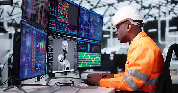 istock American Engineer Creating Futuristic Robot In Black Office 2217660303