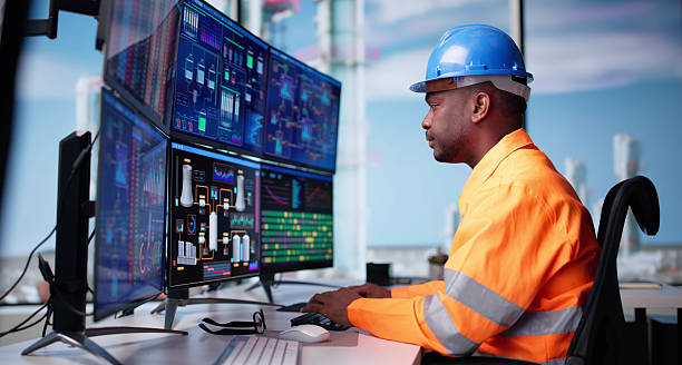 istock Industry Innovation In Action: African American Technician Monitors Chemical 2217660311