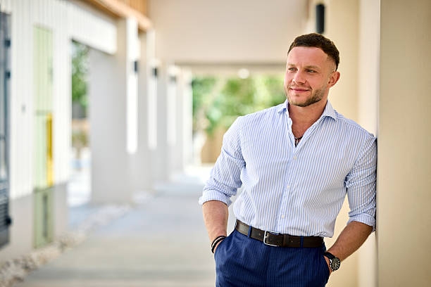 istock Thoughtful businessman with hands in pockets 2217660598