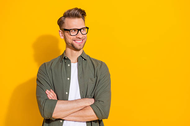 istock Portrait of attractive cheerful content guy folded arms thinking copy empty space isolated over bright yellow color background 2217661941