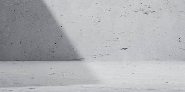 istock Minimalist concrete interior background with strong light and shadow contrast. Ideal for abstract, architectural, or modern design concepts in presentations and branding visuals. 2217662810