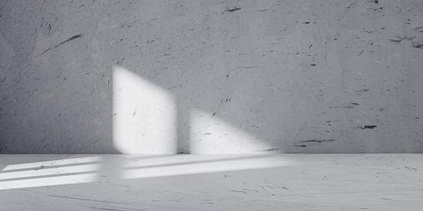 istock Minimalist concrete interior with dramatic light and shadow contrast. Perfect abstract and architectural background for design mockups, branding visuals, or modern presentation templates. 2217662813