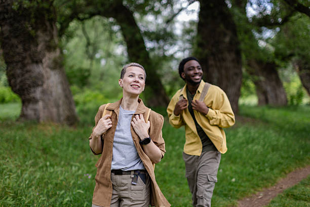 istock Friends enjoying a joyful hike through a lush forest, exploring nature on a beautiful day together 2217668555