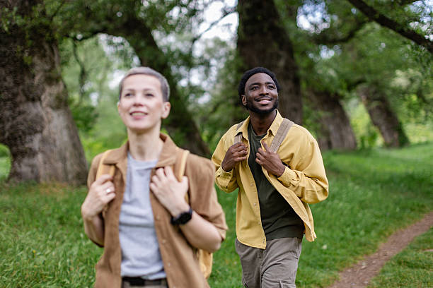 istock Friendship and adventure shine during a joyful hike through a vibrant forest with two enthusiastic explorers 2217668607