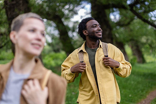 istock Happy hikers enjoy a day in nature while exploring the forest during their vacation together 2217668675