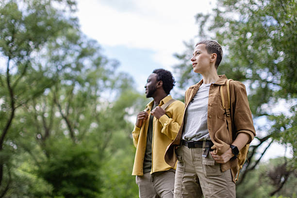 istock Exploring the great outdoors with friends on a sunny day in a lush forest 2217668689