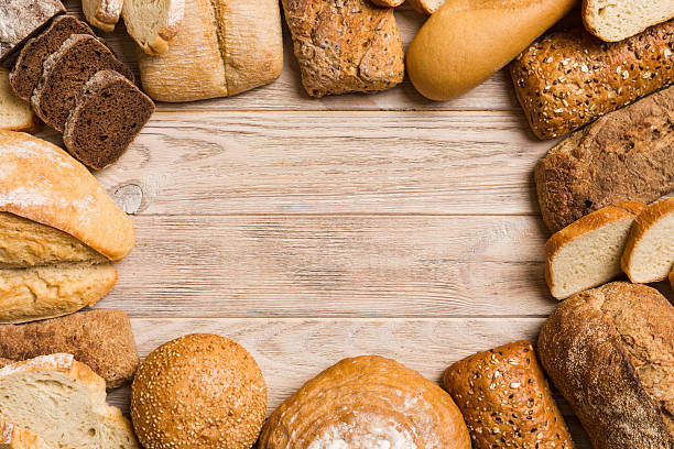 istock Homemade natural breads. Different kinds of fresh bread as background, top view with copy space 2217673432