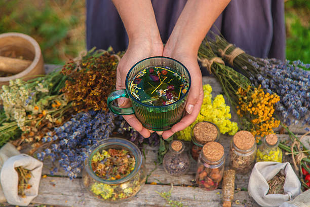 istock woman brews herbal tea. Selective focus. 2217674192