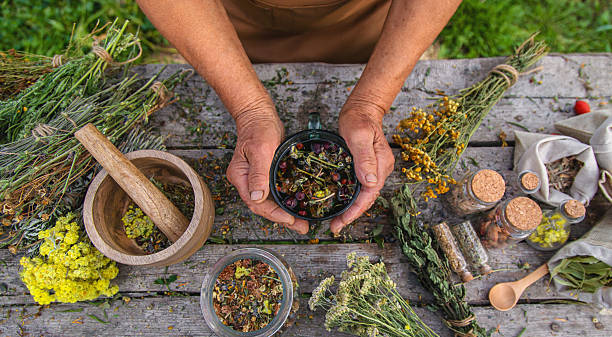 istock An elderly woman brews herbal tea. Selective focus. 2217674196