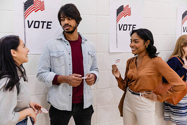 istock Young adults smiling after voting in election 2217675262