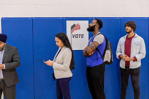 istock Multiracial People in Line at Polling Place 2217675266