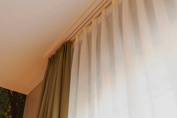 istock Soft natural light filters through sheer and solid curtains in a tranquil indoor setting, creating a warm and inviting atmosphere perfect for relaxation 2217676714