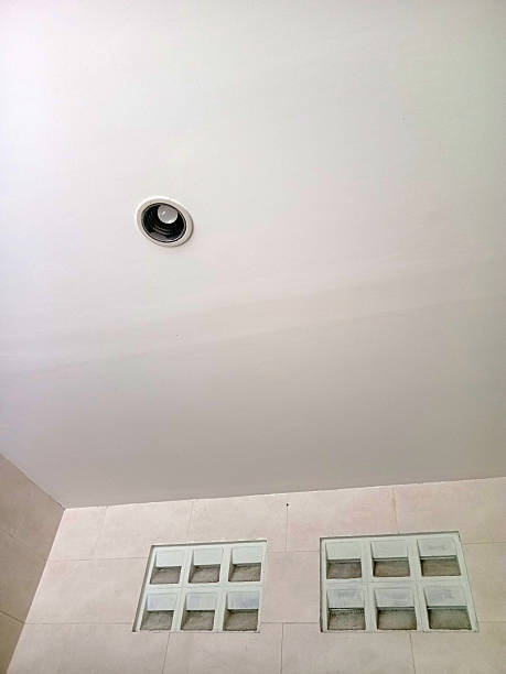 istock Minimalist ceiling with recessed light and glass block windows 2217676878