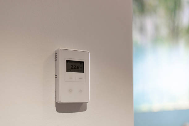 istock A digital thermostat is mounted on a wall displaying a temperature of 22.6 degrees Celsius. The setting indicates a comfortable climate in a contemporary environment 2217677489