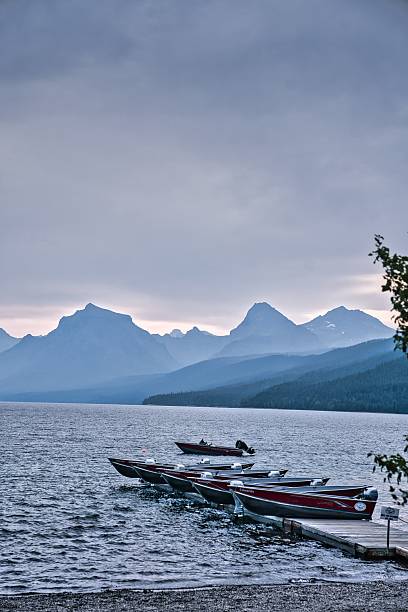 istock Mountain Lake with Docked Boats at Sunrise 2217679277