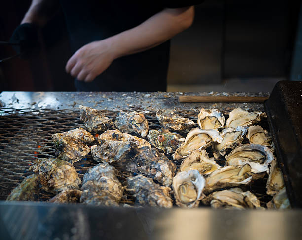 istock Grilled Oysters on Japanese Street Grill 2217681102