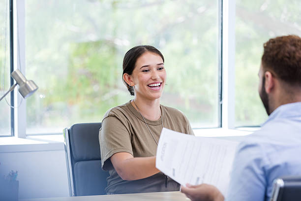 istock Happy Female Veteran Sharing Documents During a Meeting 2217681392