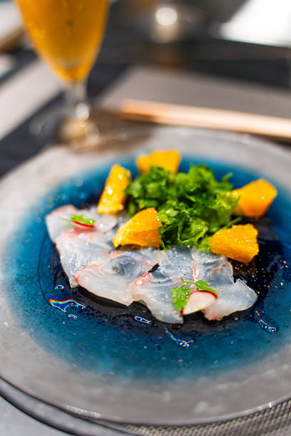 White Fish Carpaccio with Uni and Herbs