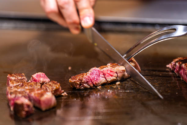 istock Slicing Wagyu Steak on Teppanyaki Grill 2217681591