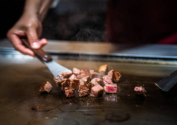 istock Grilling Wagyu Beef Cubes on Teppanyaki Grill 2217681607