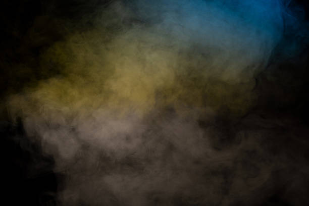 istock Blue and yellow steam on a black background. 2217684443