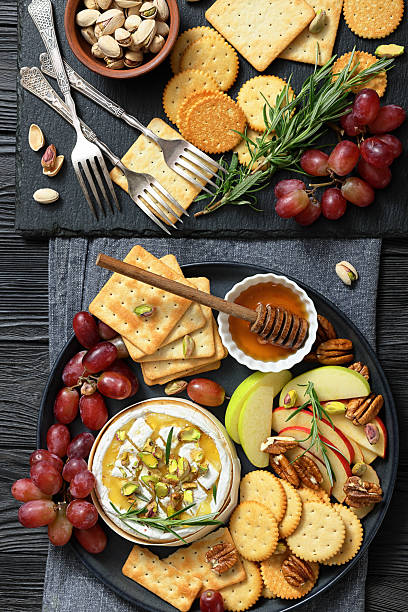 istock Baked Camembert with honey, pistachios, top view 2217686565