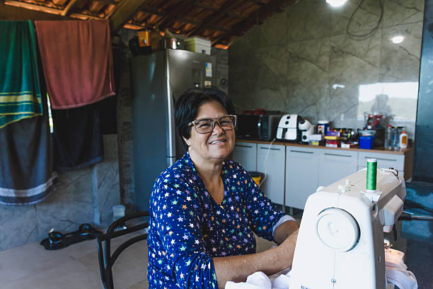 May 25th, Seamstress' Day, lady practicing the art of sewing in her home