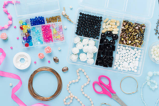 istock Tools and beads for making handmade jewelry on color background, top view 2217687860