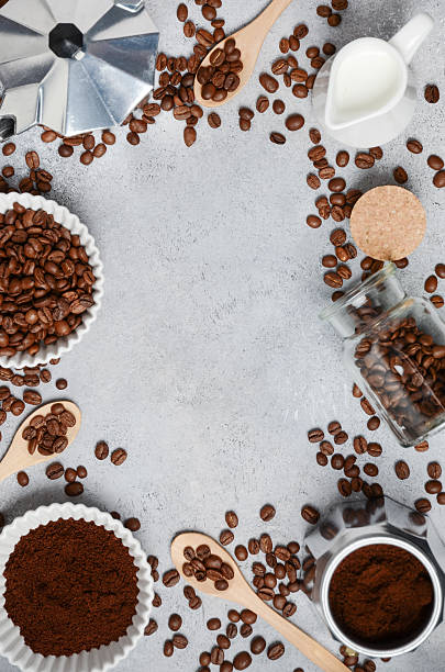istock Coffee beans, ground coffee, and brewing tools arranged on a textured surface, creating an inviting atmosphere for coffee lovers and enthusiasts 2217688307