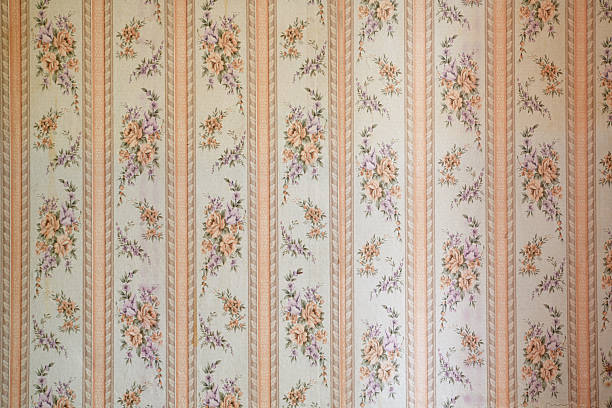 istock Old wallpaper on the wall. Old wallpaper for texture or background. 2217688430