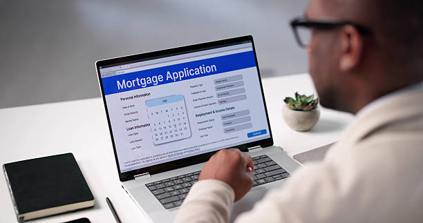 istock Online Mortgage Application: Young African American Man Approves 2217690002