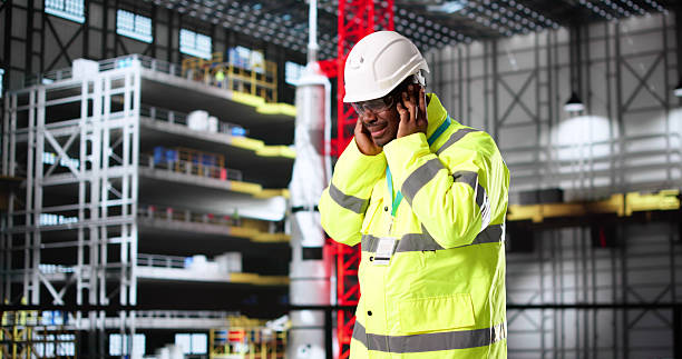 istock Engineer Regretting Decision To Skip Ear Protection At Car Factory 2217690064