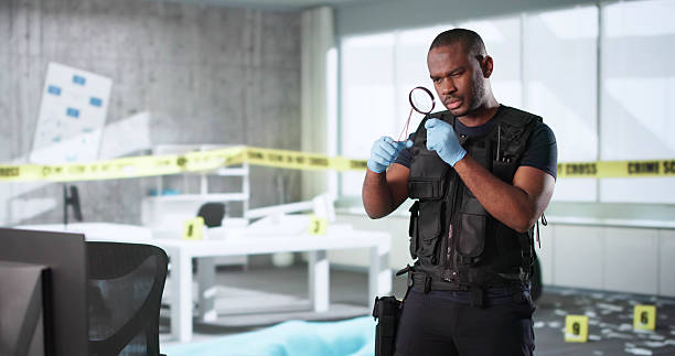 istock Young Male Investigator Analyzing Evidence In Office 2217690067