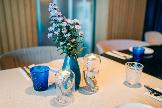 istock Elegant dining table setting with flowers and candles in a modern restaurant interior 2217690406
