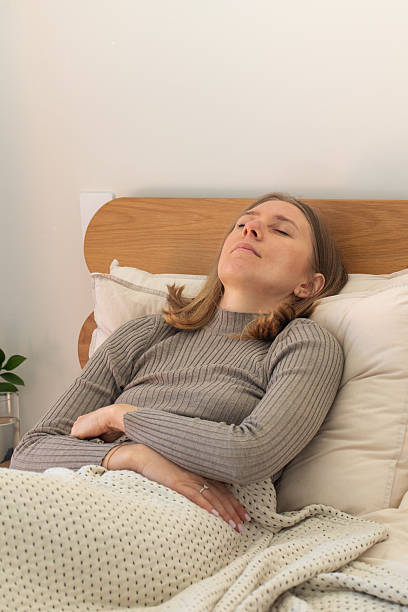 istock Young caucasian female resting peacefully in cozy bedroom setting 2217691222