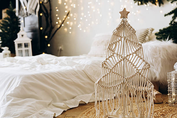 istock Creative macrame Christmas tree decor in a cozy holiday setting with soft lighting 2217693730