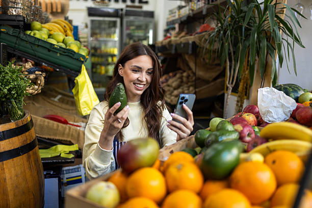 istock Lovely lady selecting fresh products for her grocery store 2217694730