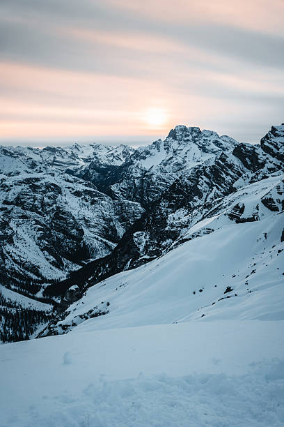istock Sunrise over snowcapped mountain pinnacles 2217695020