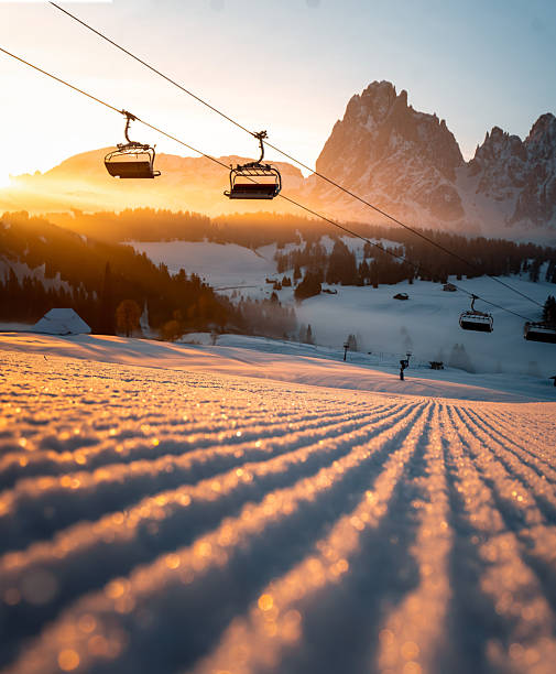Ski slope and chairlift at sunset