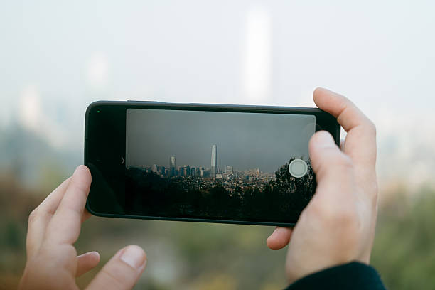 istock Capturing a city skyline with a smartphone from a natural lookout 2217695402