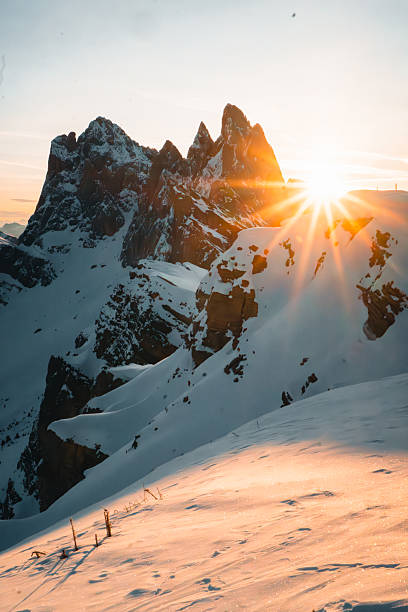 Sunrise over snowcapped mountain pinnacles