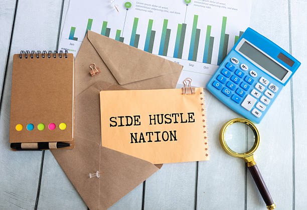 istock SIDE HUSTLE . Notepad and office supplies on a light background 2217696234
