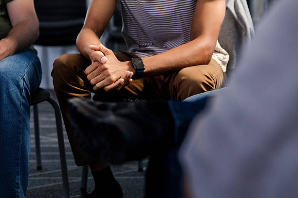 istock Group therapy session: Diverse people in discussion, seeking mental wellbeing 2217696649