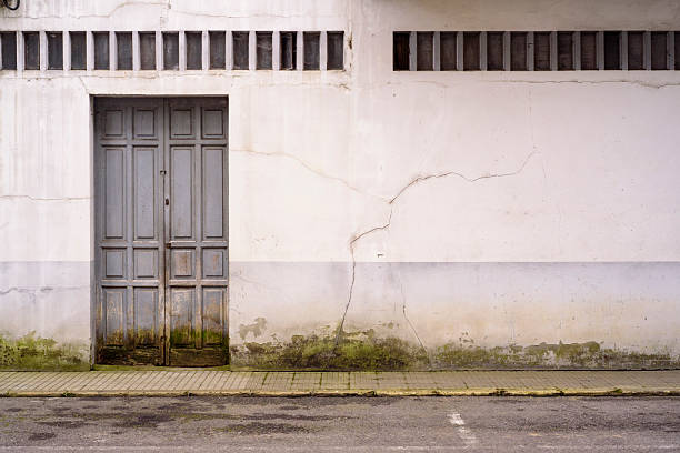 istock Rustic door in decay alley 2217697674