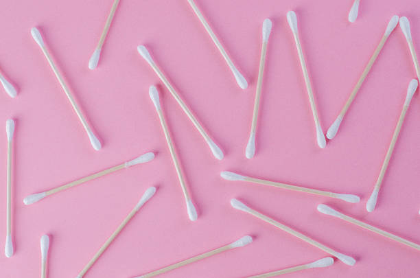 istock Scattered cotton swabs on pink background in chaotic arrangement 2217697679