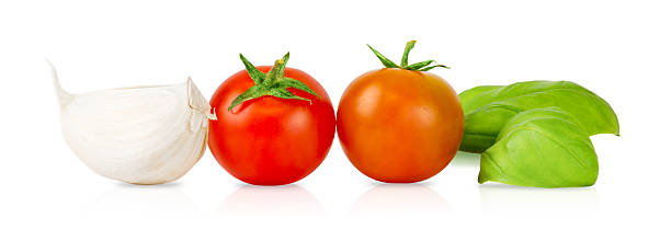 istock Fresh Garlic, Tomatoes, and Basil Isolated on White Background 2217697694
