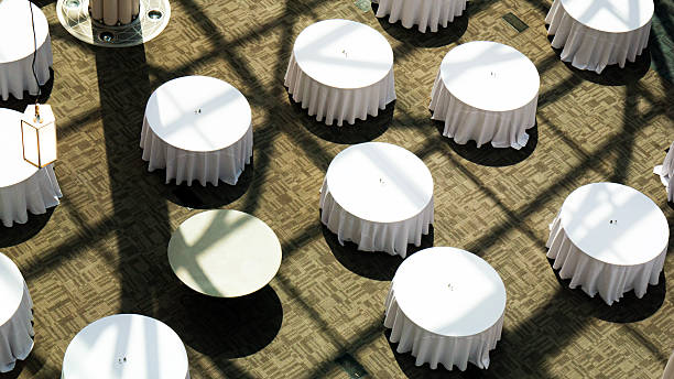 istock Banquet tables with white tablecloths, high angle view 2217699382