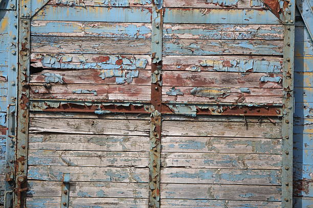 istock Old peeling paint on an abandoned freight car at a railway station 2217700218
