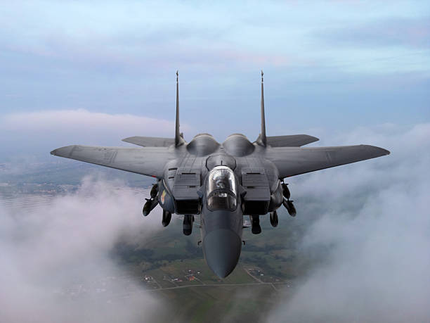 istock F-15 Fighter jet in flight over the clouds 2217701379