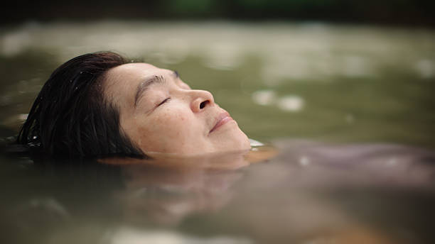 istock Woman floating in river. 2217702731